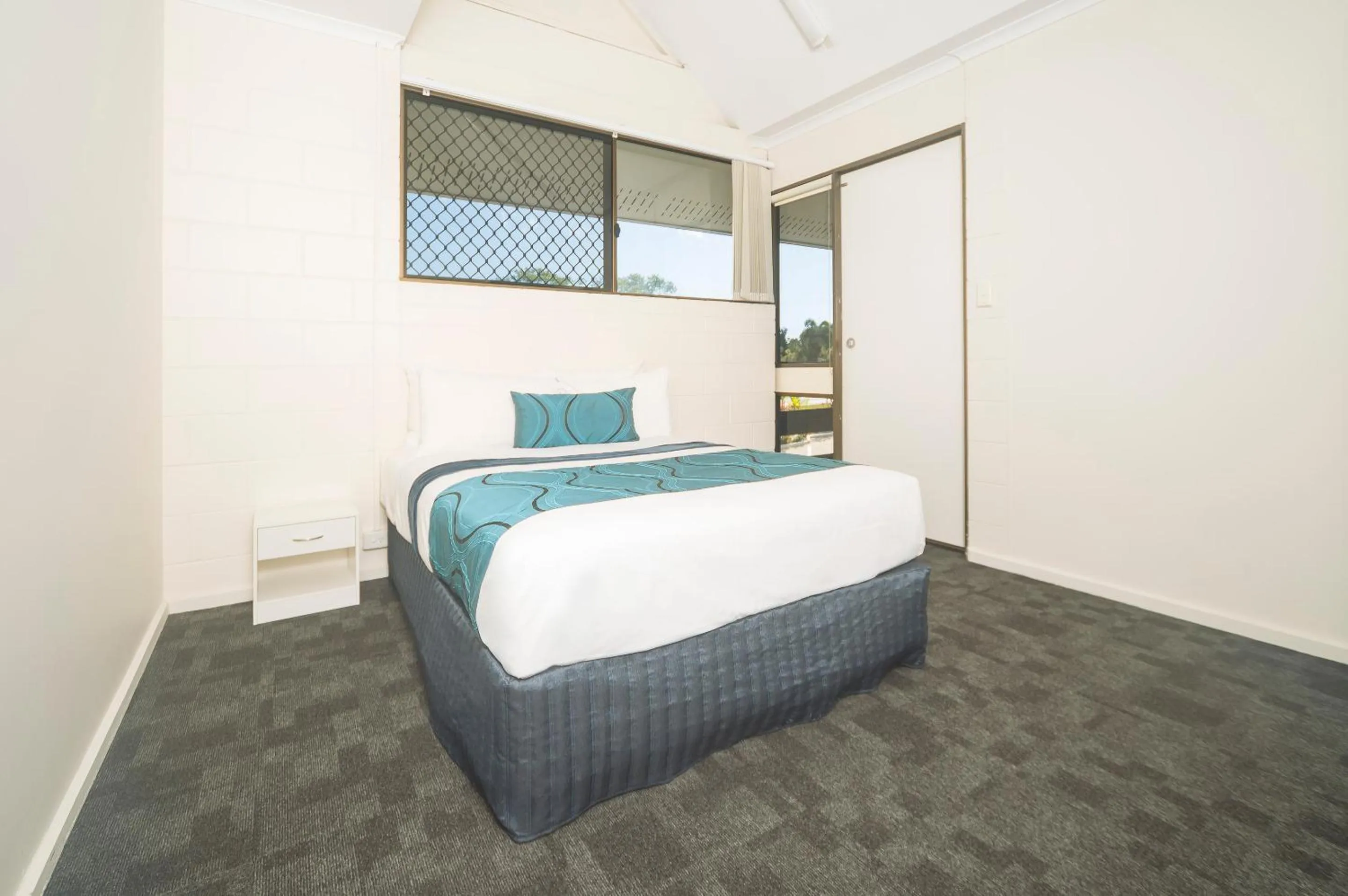Bed in Reef Gateway Hotel