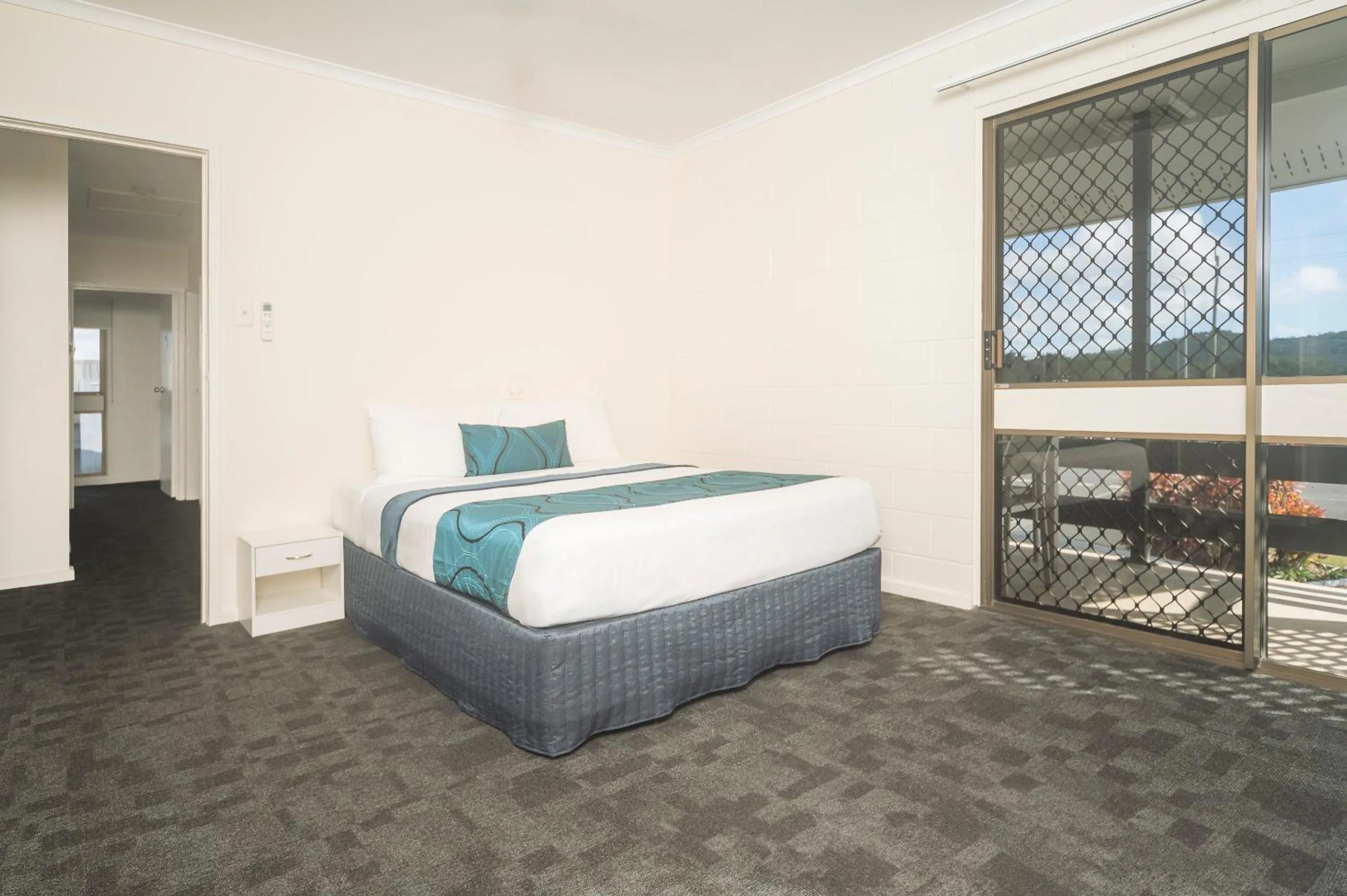 Bed in Reef Gateway Hotel