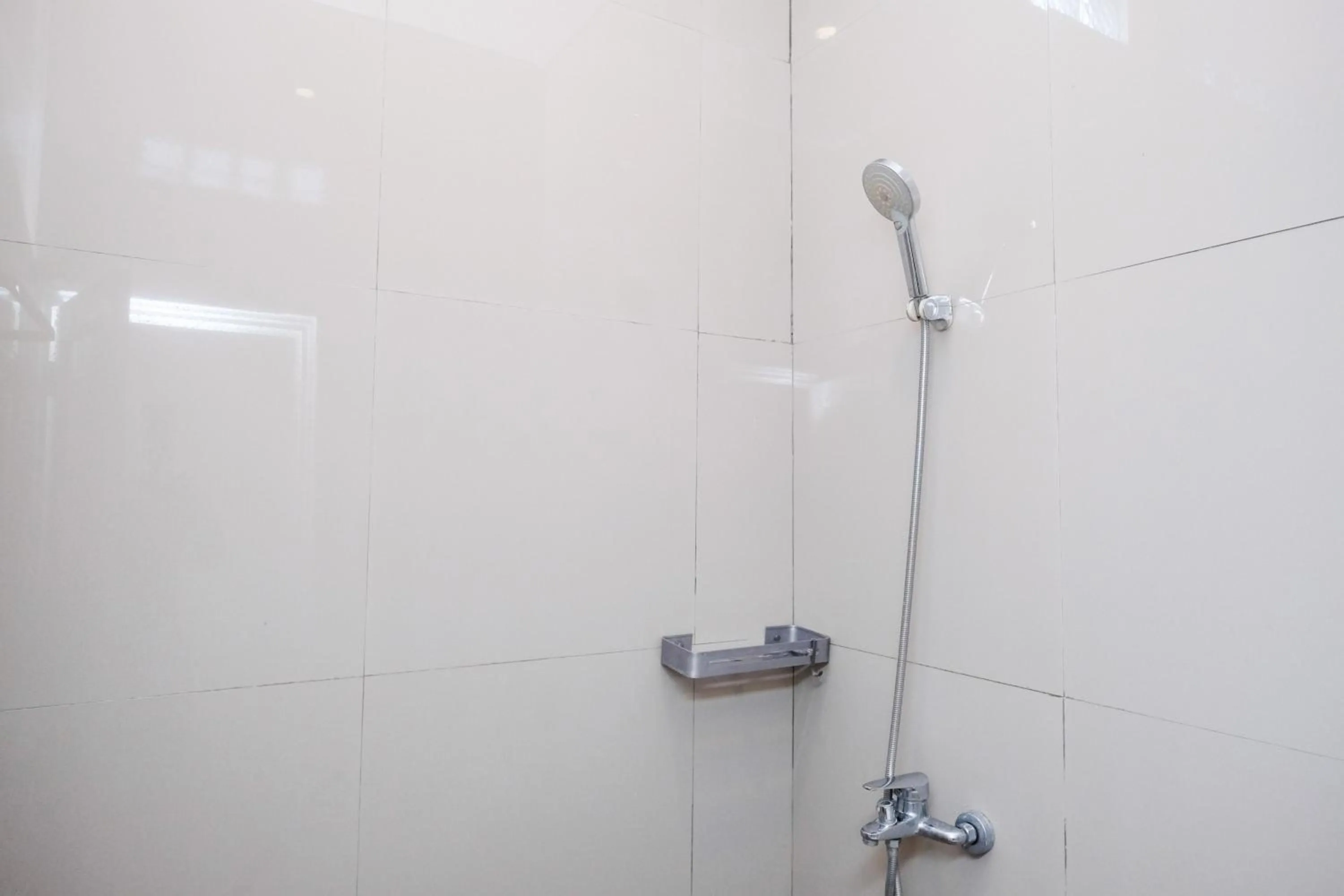 Bathroom in Urbanview Hotel Dommy Yogyakarta by RedDoorz