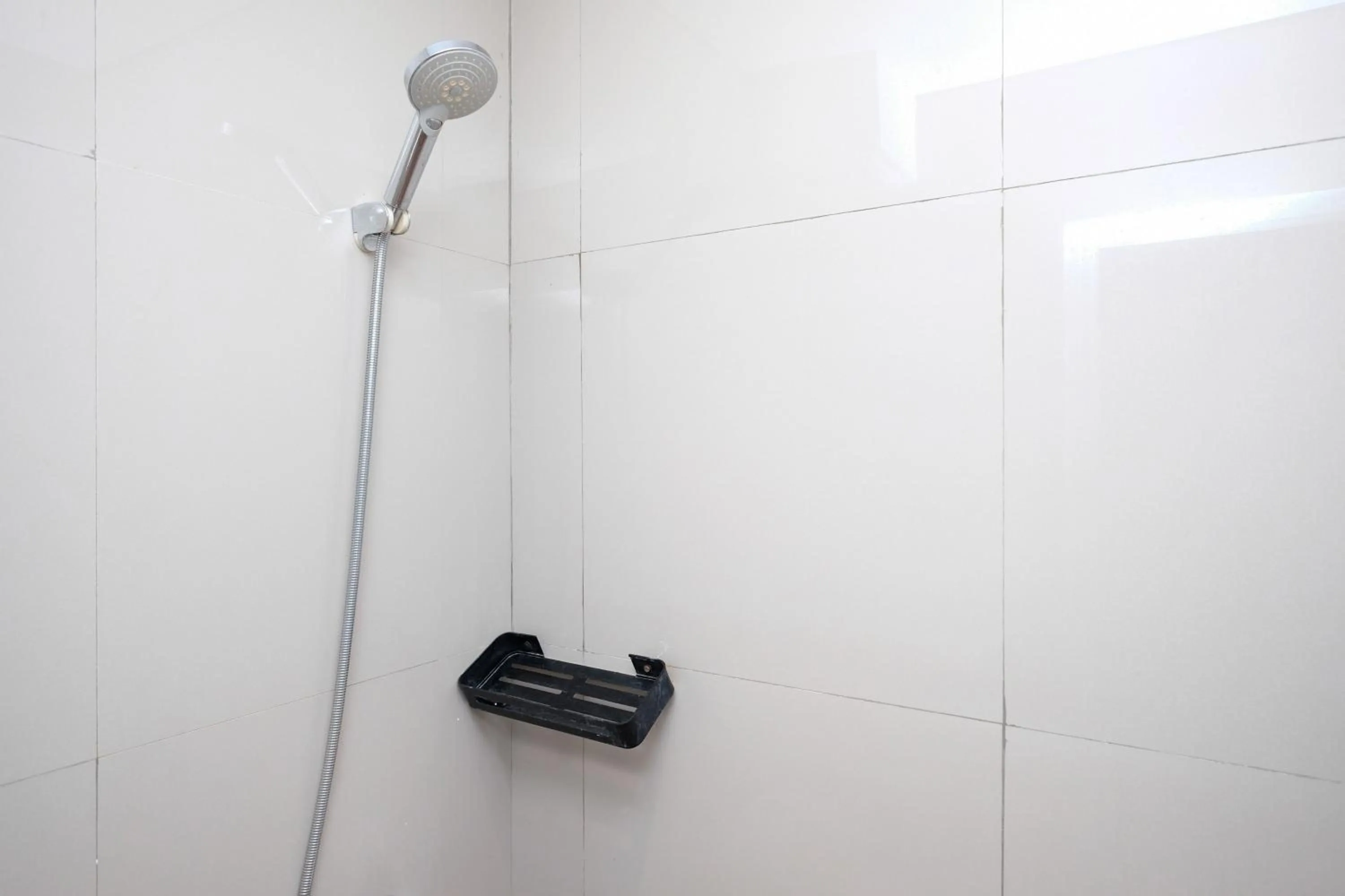 Bathroom in Urbanview Hotel Dommy Yogyakarta by RedDoorz