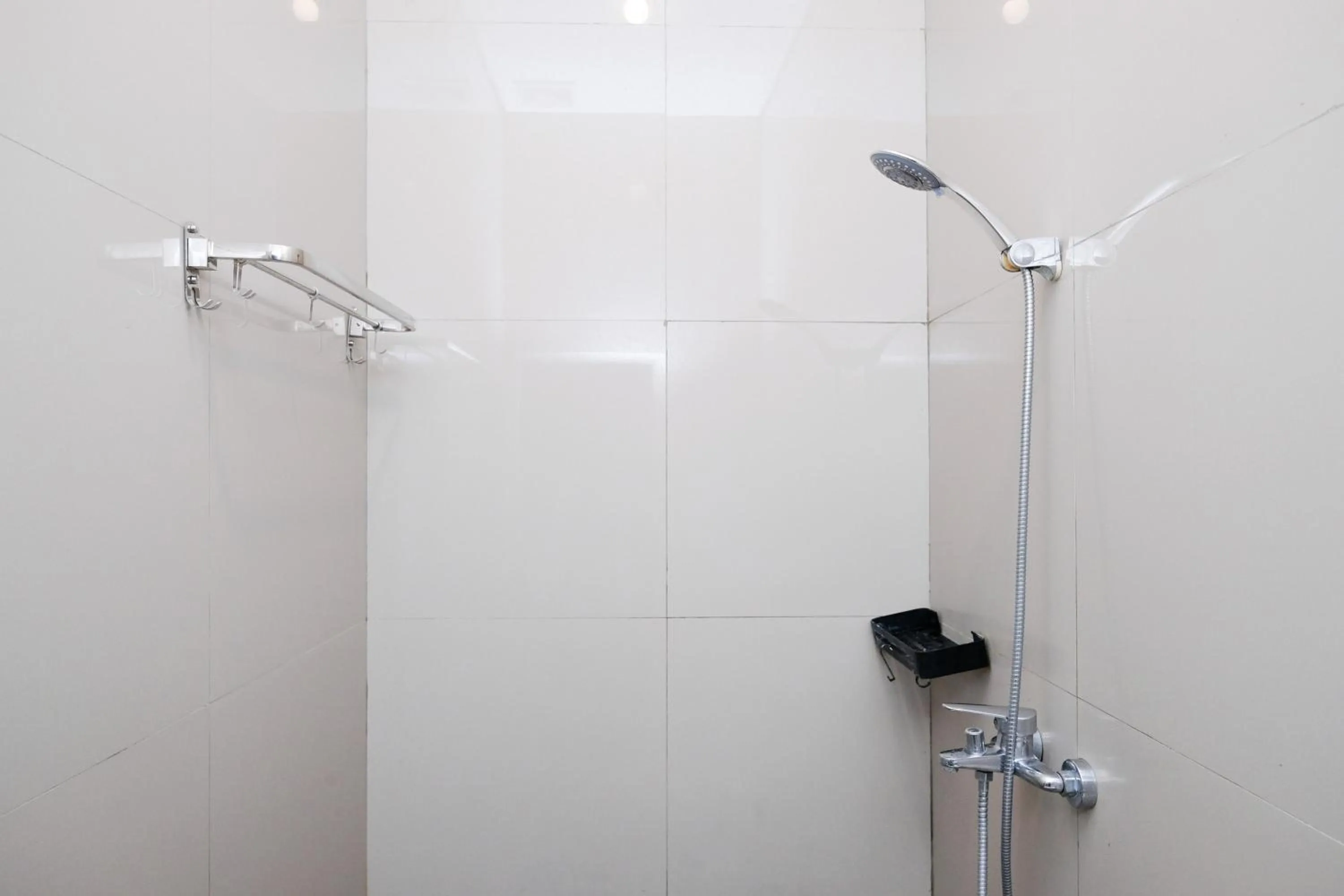 Bathroom in Urbanview Hotel Dommy Yogyakarta by RedDoorz