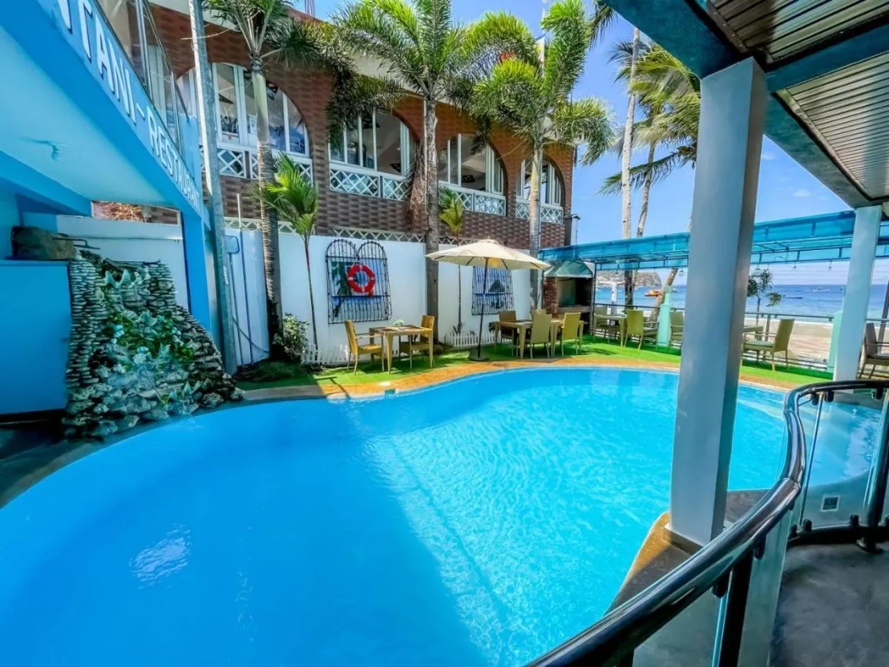 Swimming pool in Montani Beach Resort Puerto Galera powered by Cocotel