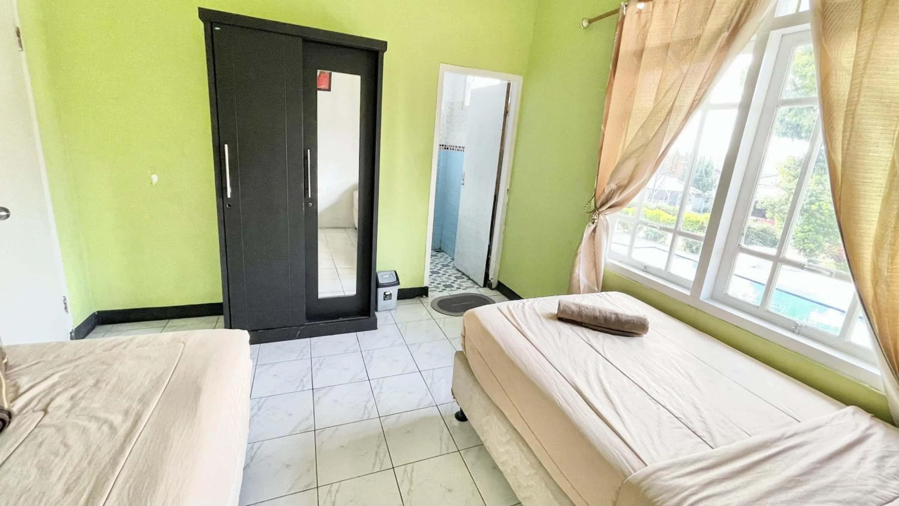 Bed in The Kanzi Hotel & Village