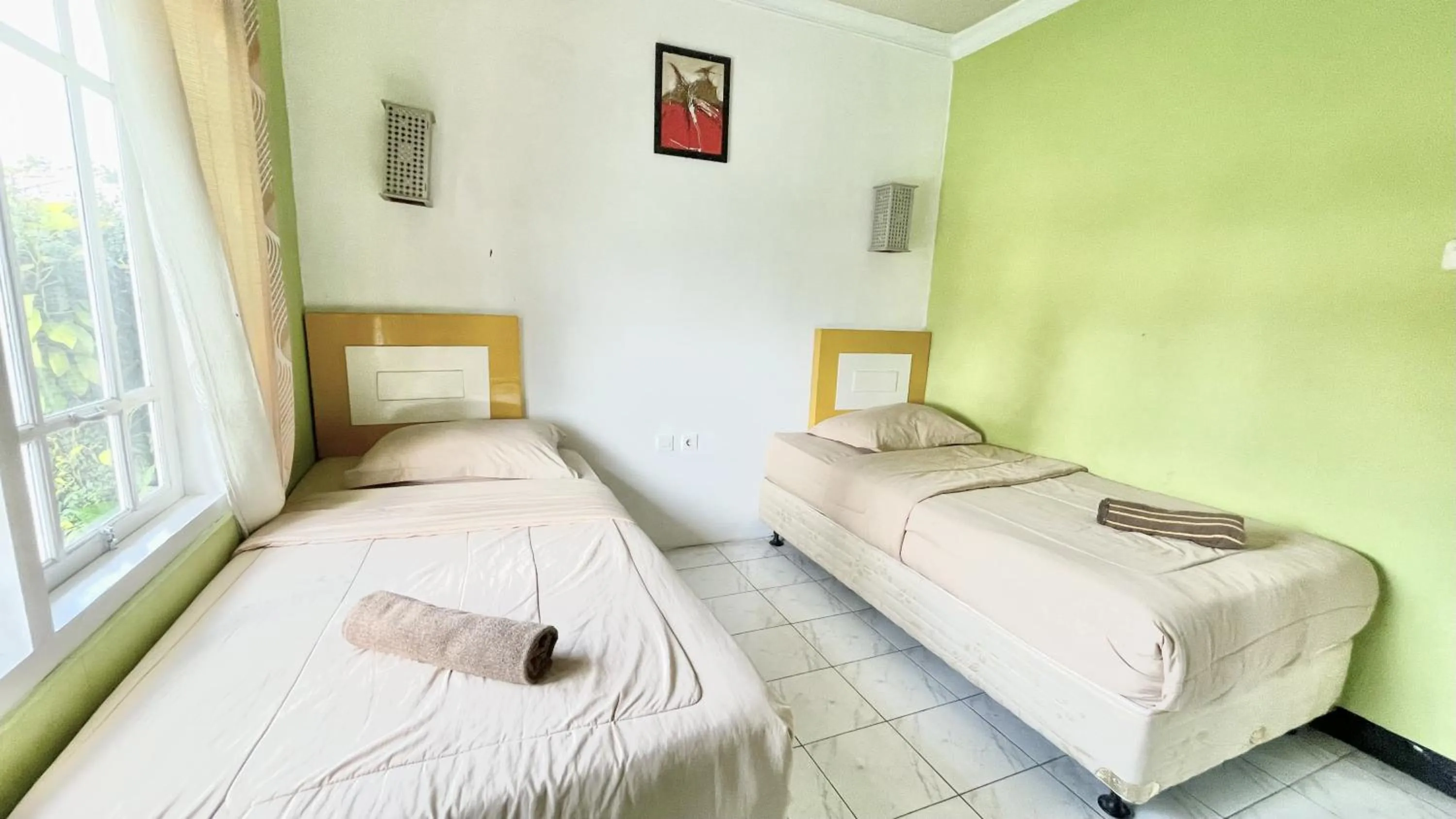 Bed in The Kanzi Hotel & Village