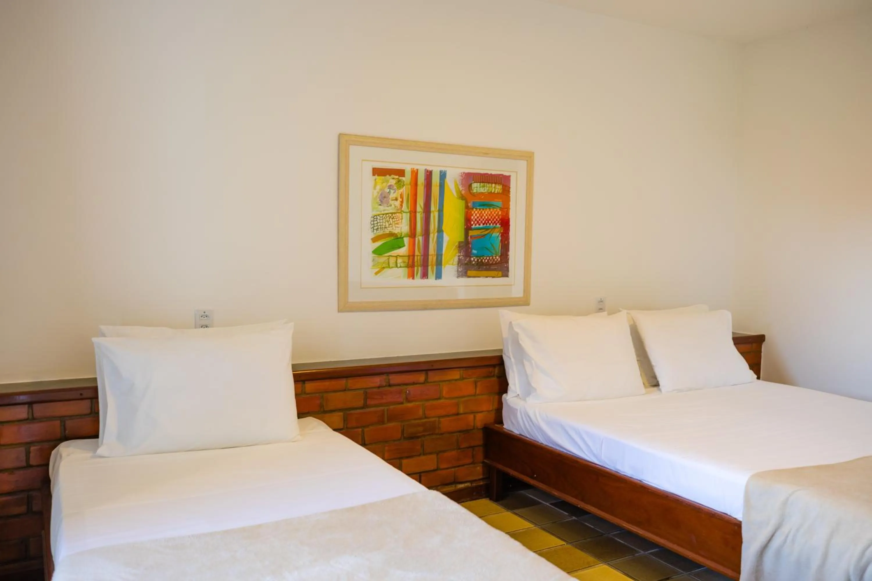 Bed in Mirai Beach Hotel