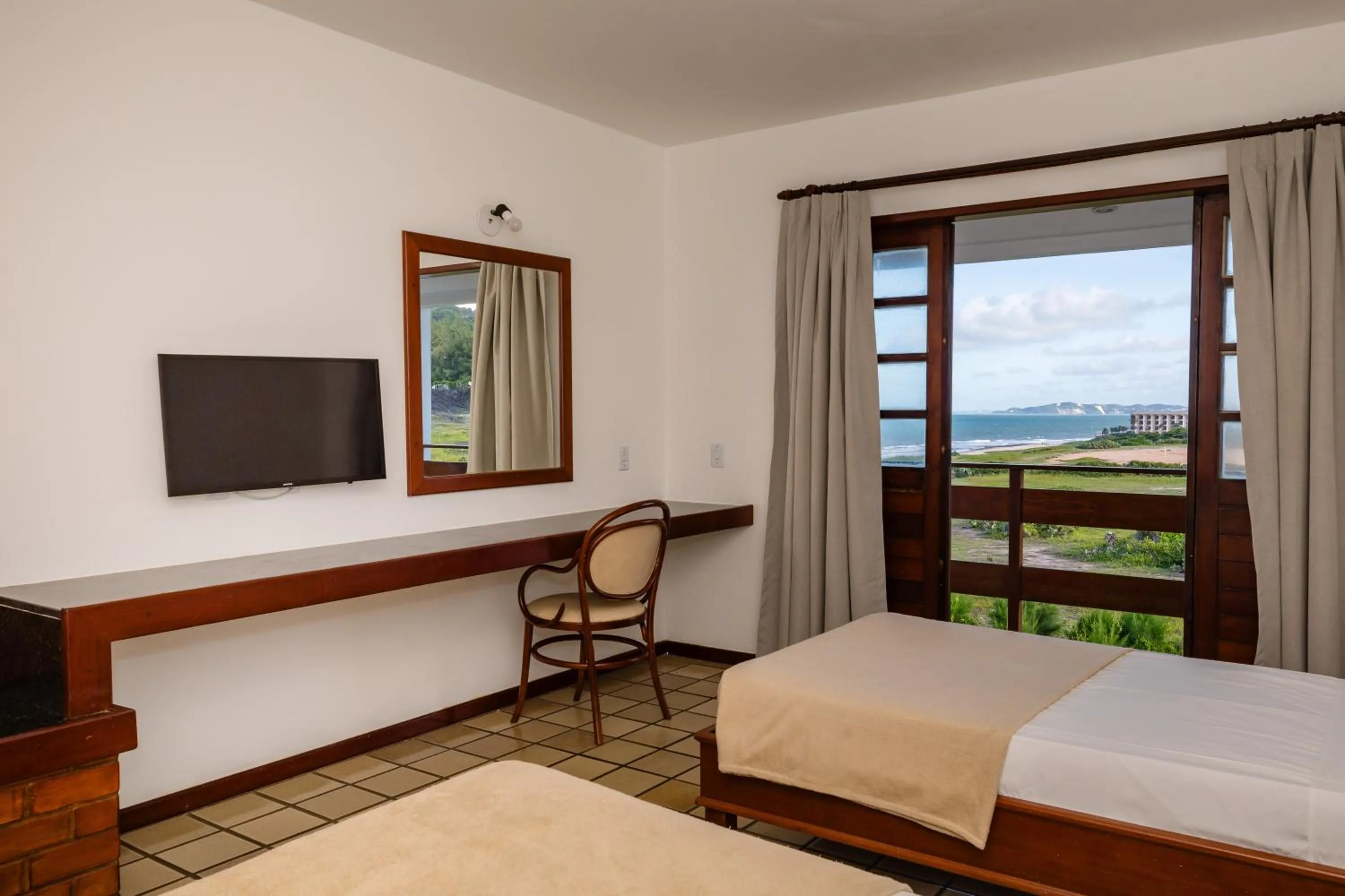 Bed in Mirai Beach Hotel