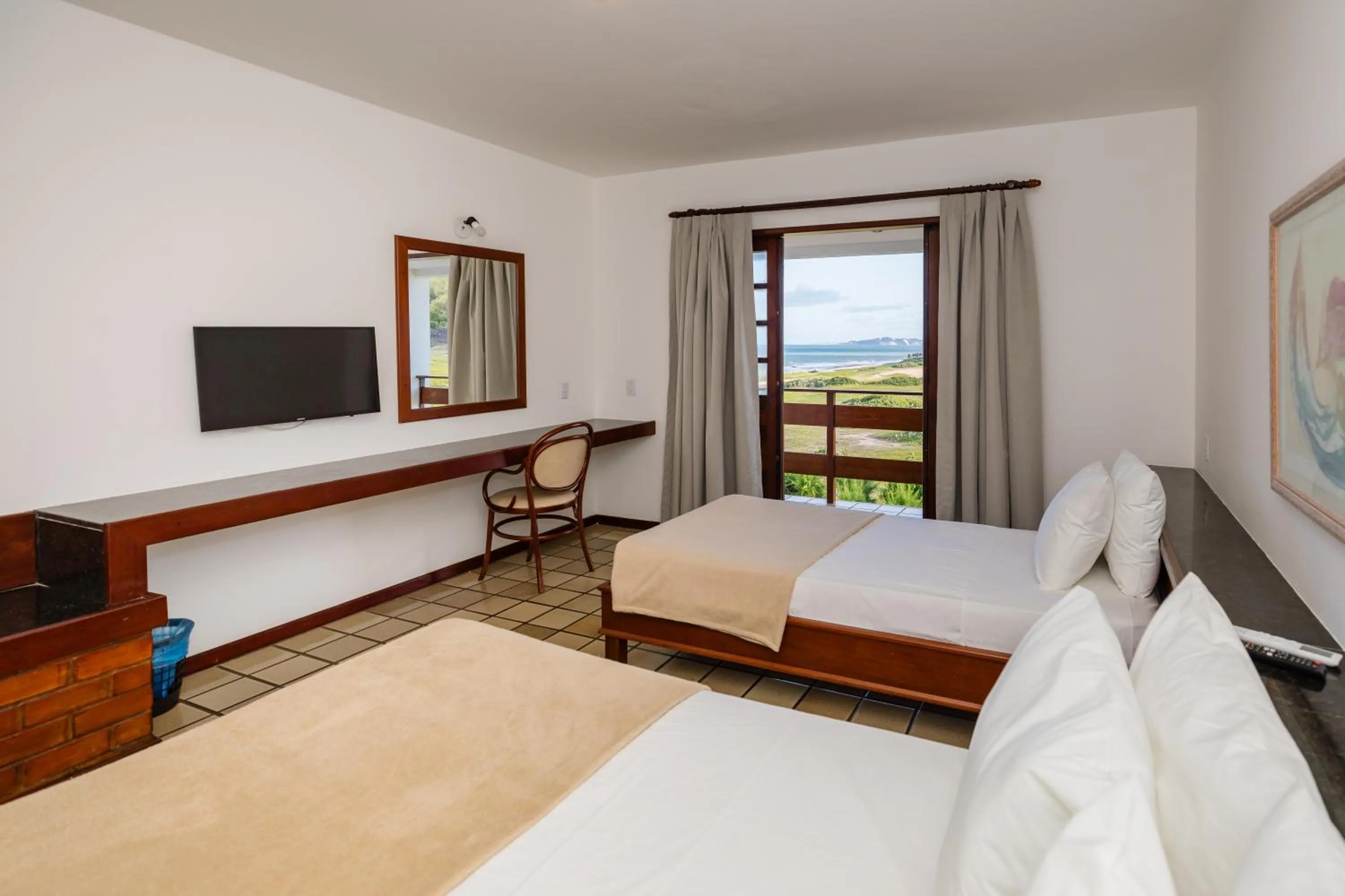 Bed in Mirai Beach Hotel