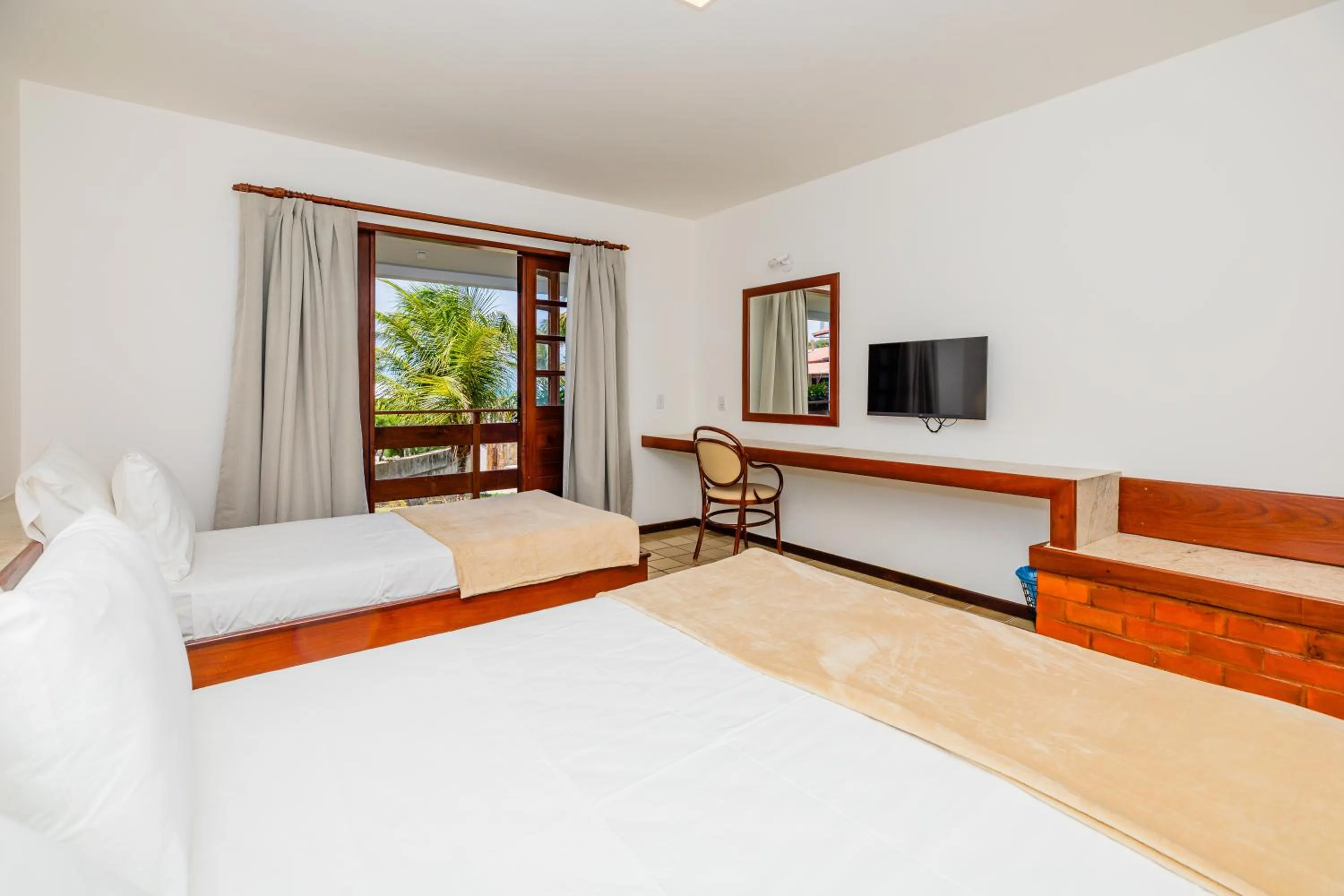 Bed in Mirai Beach Hotel