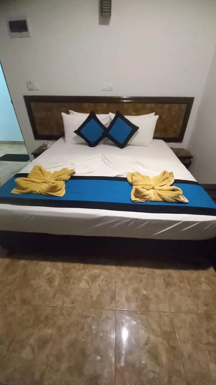Bed in Blue Sand Beach Resort