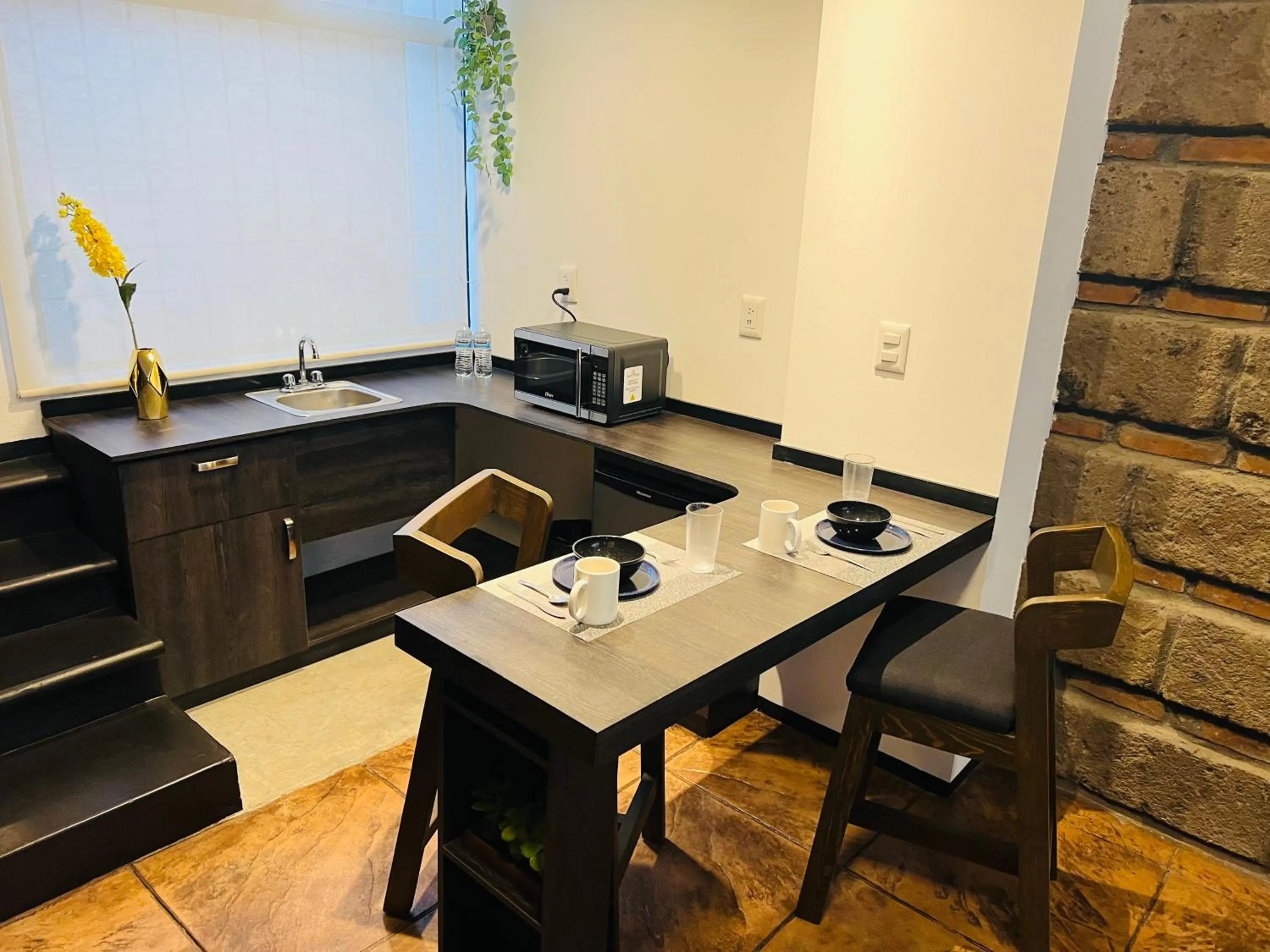 Kitchen or kitchenette in QA Hotel