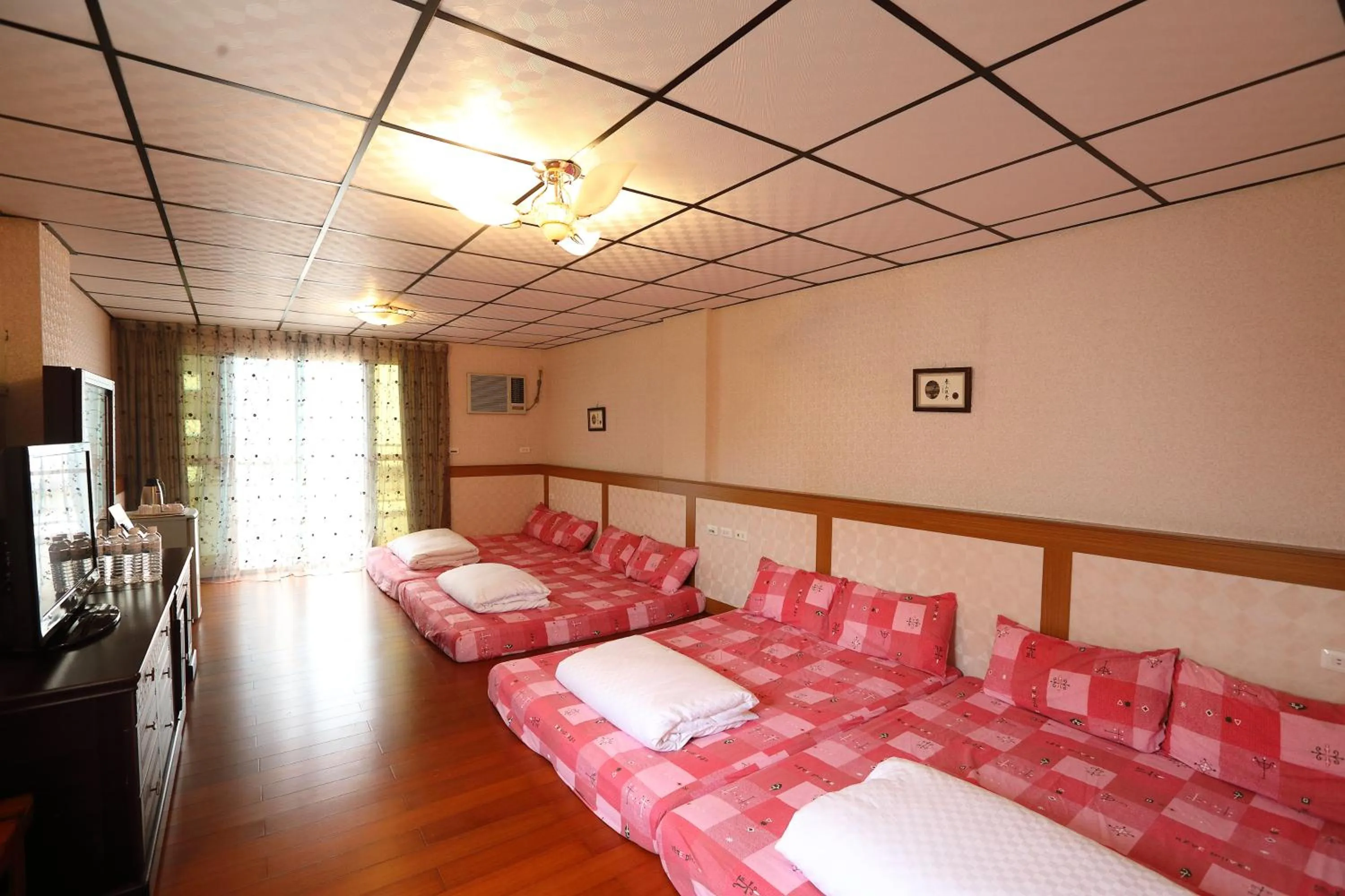 Photo of the whole room, Bed in First Place B&B (Hualien Railway Station)