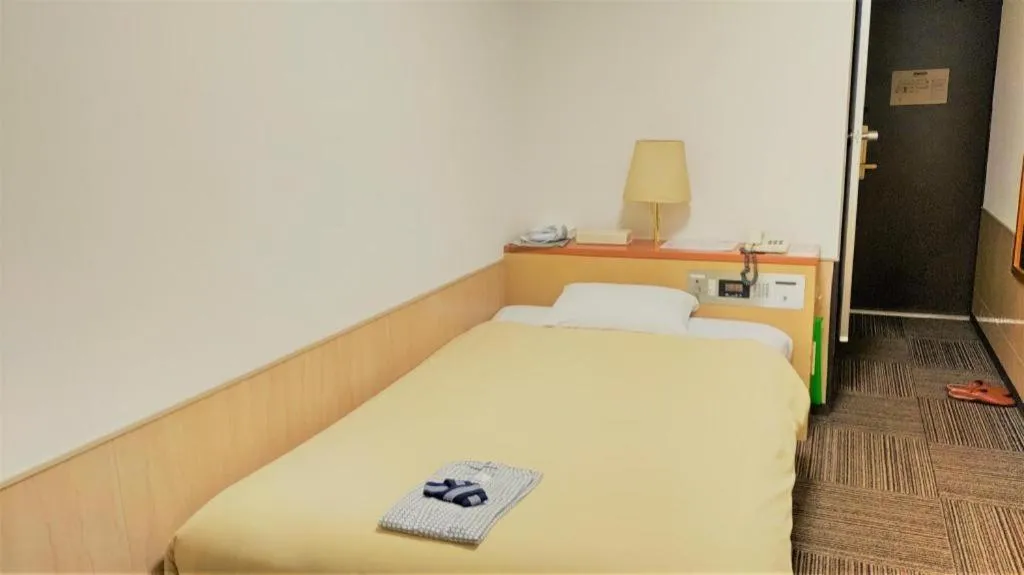 Bed in Ikebukuro Royal Hotel