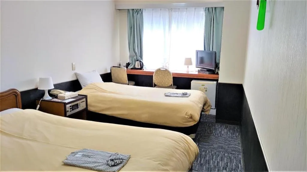 Bed in Ikebukuro Royal Hotel