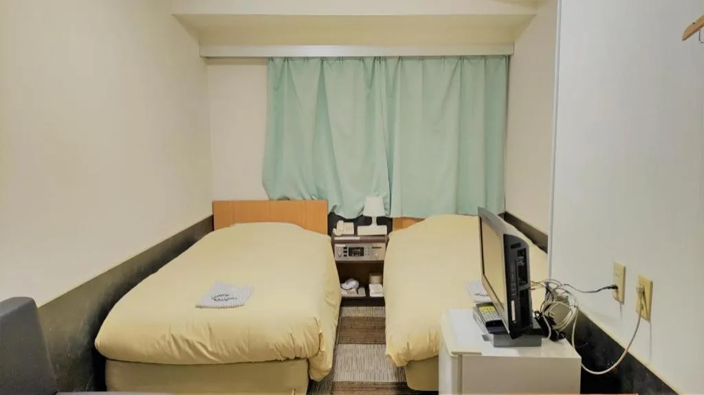 Bed in Ikebukuro Royal Hotel