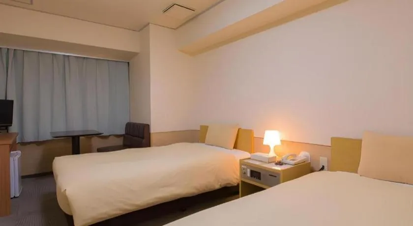 Bed in Ikebukuro Royal Hotel