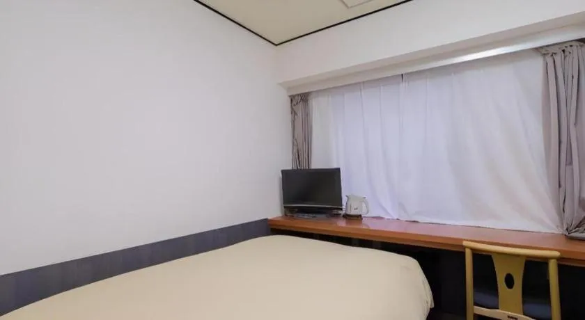 Bed in Ikebukuro Royal Hotel