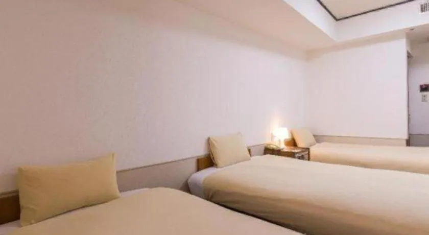 Bed in Ikebukuro Royal Hotel