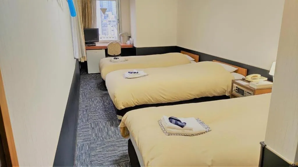 Bed in Ikebukuro Royal Hotel