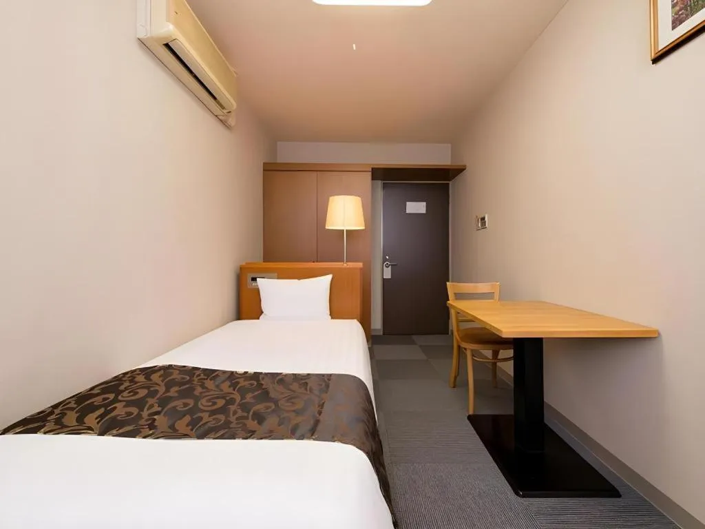 Bed in New Biwako Hotel