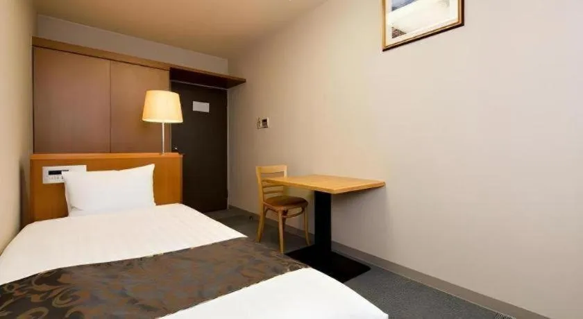 Bed in New Biwako Hotel