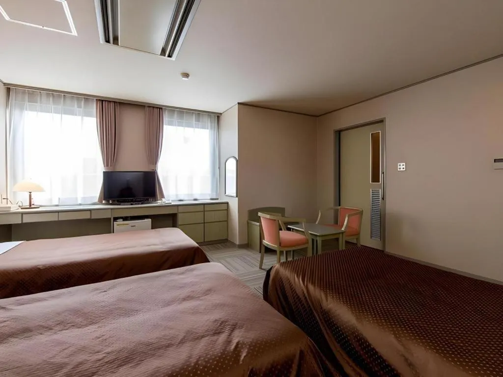 Bed in New Biwako Hotel