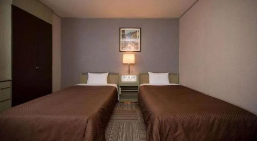 Bed in New Biwako Hotel