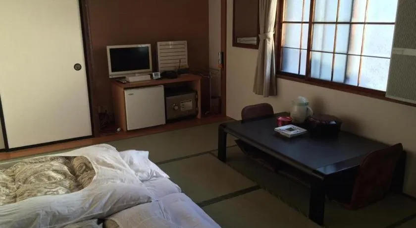Bed in Hotel Kikuya