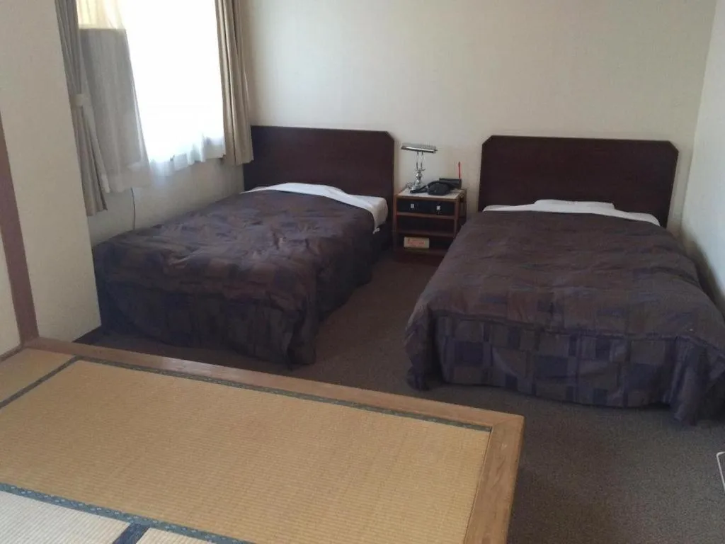 Bed in Hotel Kikuya