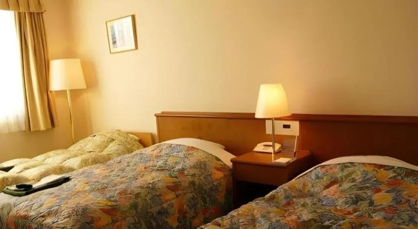 Bed in Kamisuwa Station Hotel