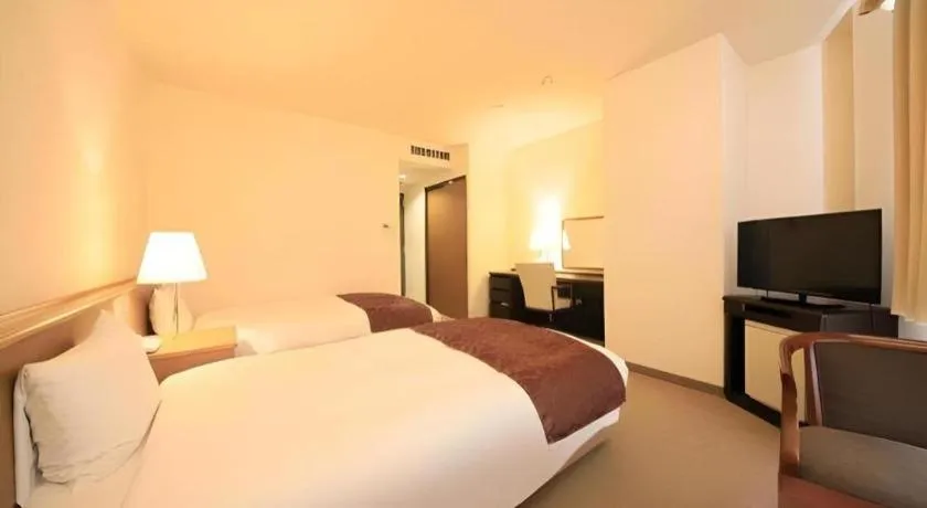 Bed in Kamisuwa Station Hotel