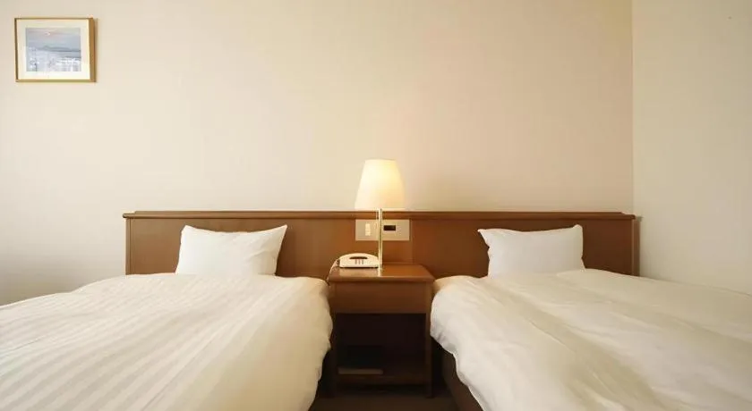 Bed in Kamisuwa Station Hotel