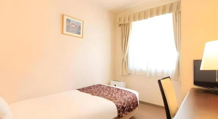 Bed in Kamisuwa Station Hotel