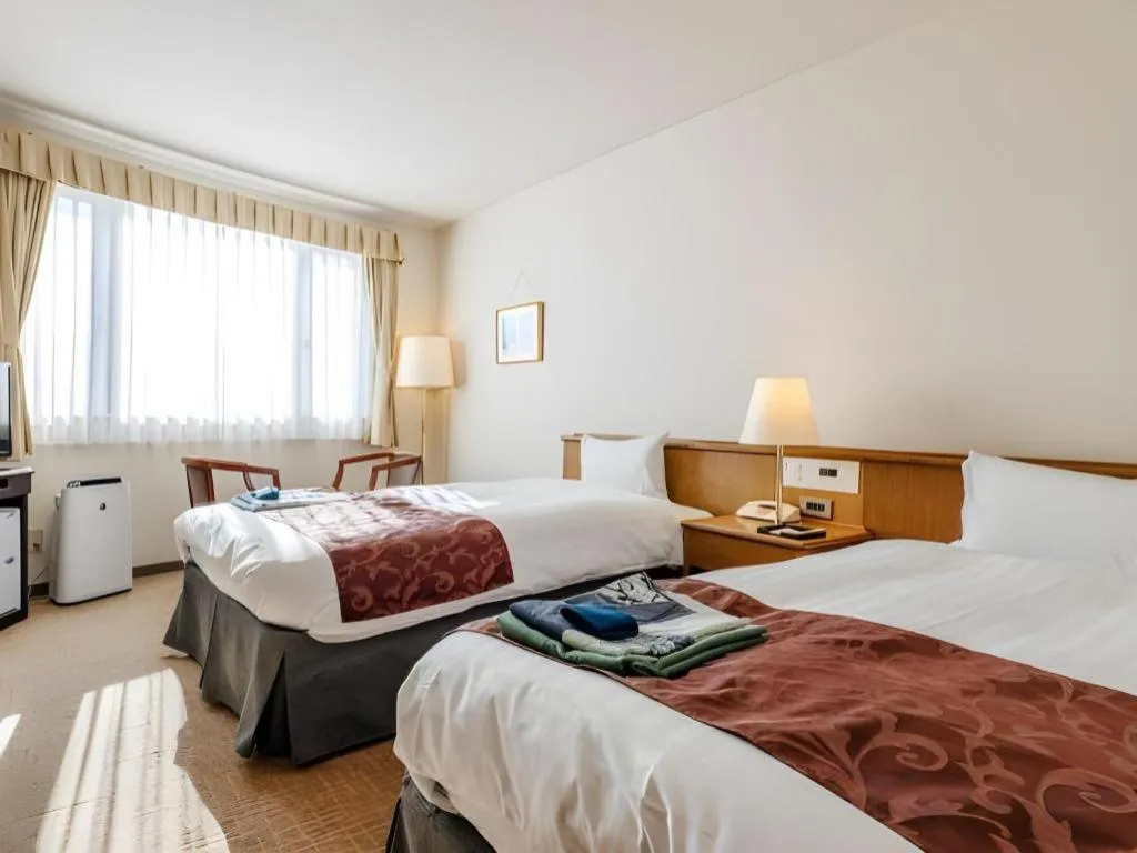 Bed in Kamisuwa Station Hotel