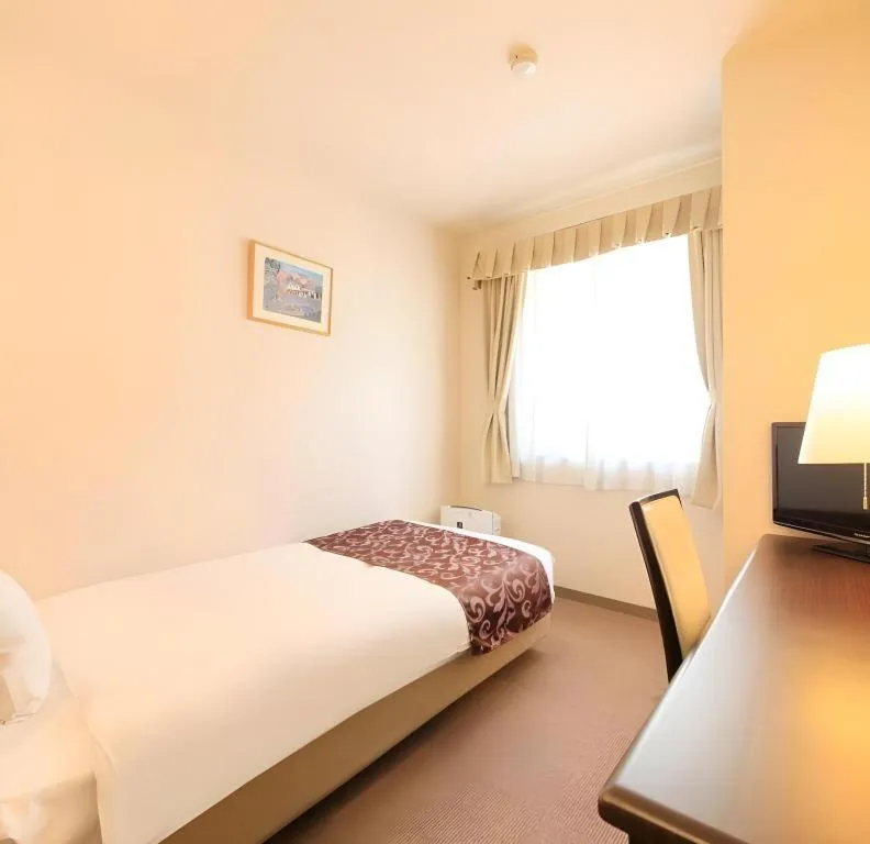 Bed in Kamisuwa Station Hotel