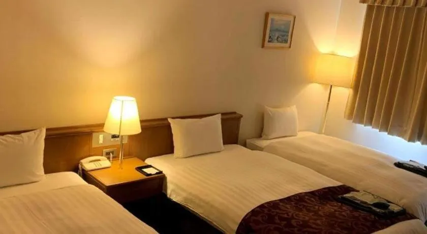 Bed in Kamisuwa Station Hotel