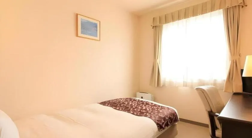 Bed in Kamisuwa Station Hotel