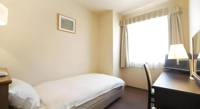 Bed in Kamisuwa Station Hotel