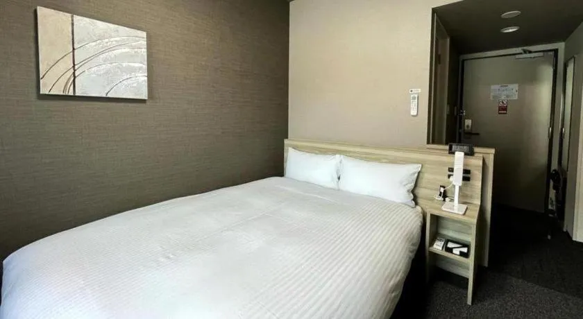 Bed in Hotel Route Inn Miyakonojo