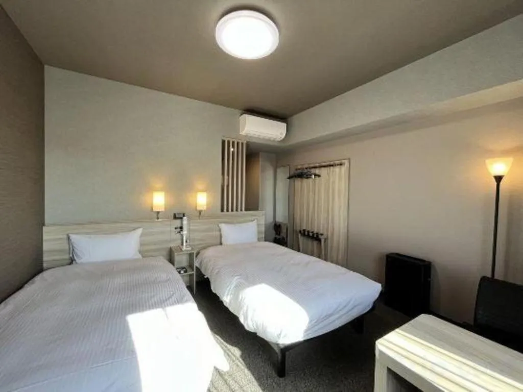 Bed in Hotel Route Inn Miyakonojo