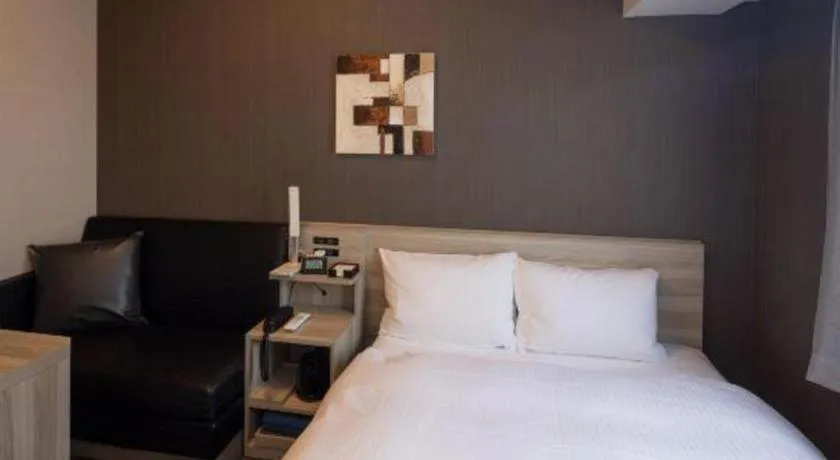 Bed in Hotel Route Inn Miyakonojo
