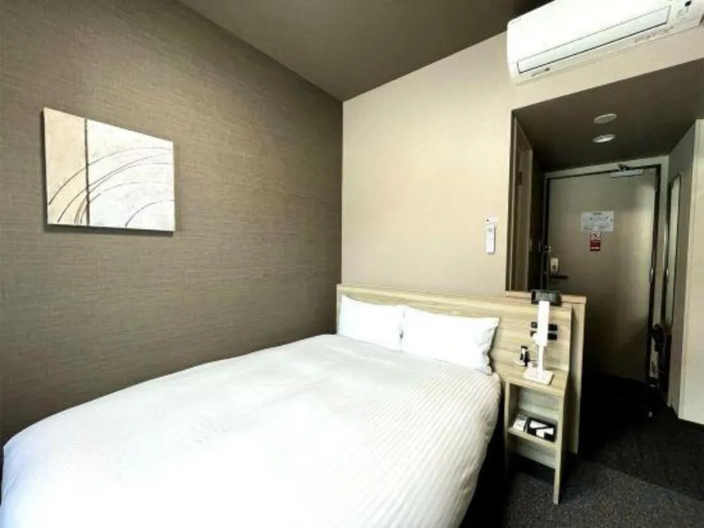 Bed in Hotel Route Inn Miyakonojo