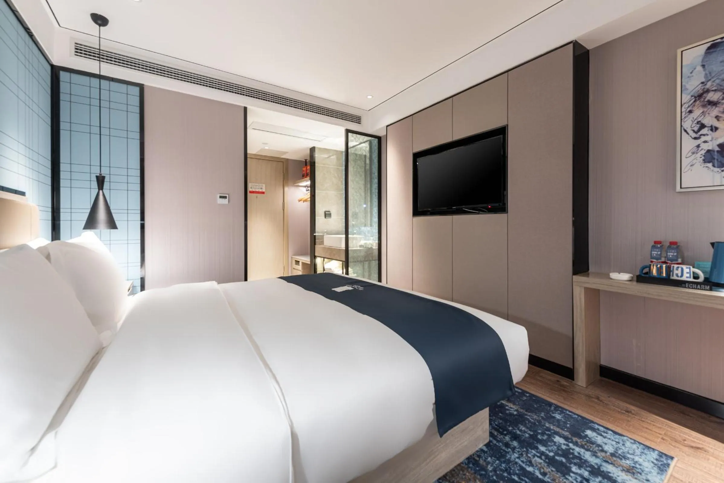 Bed in Echarm Hotel Yangshuo West Stree