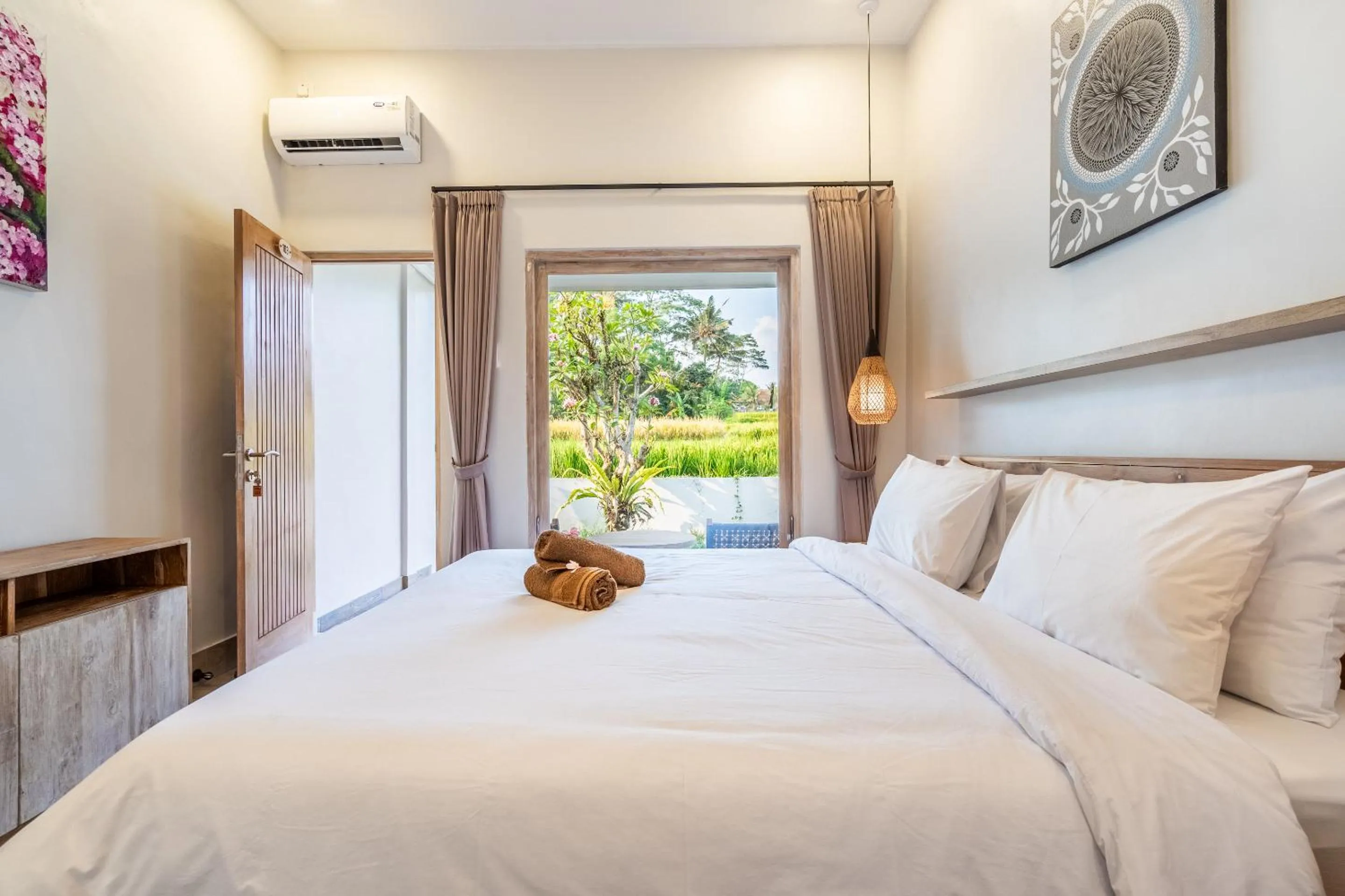 Bed in Aura Apartments Ubud