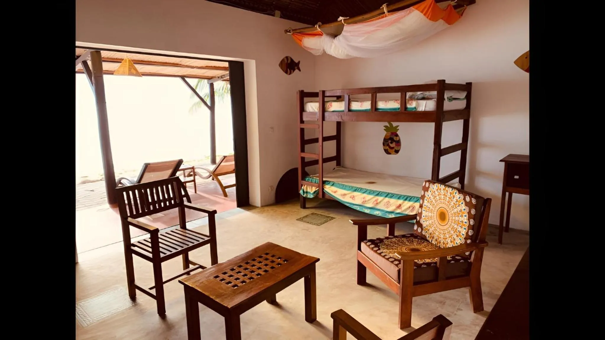 Living room, Bed in Libertalia Hotel