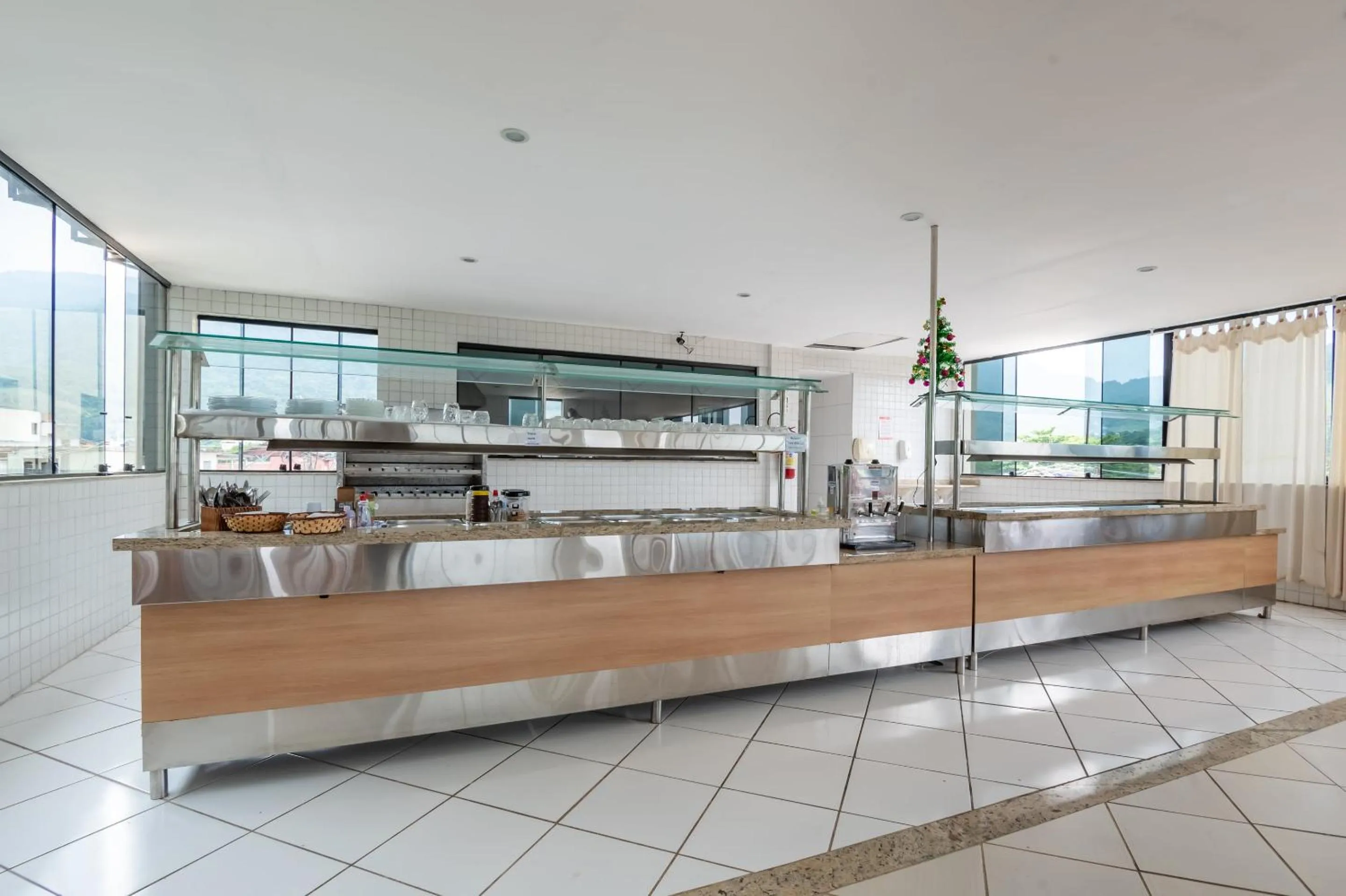 Kitchen or kitchenette in OYO Residencial Muriqui Apart Hotel, Mangaratiba