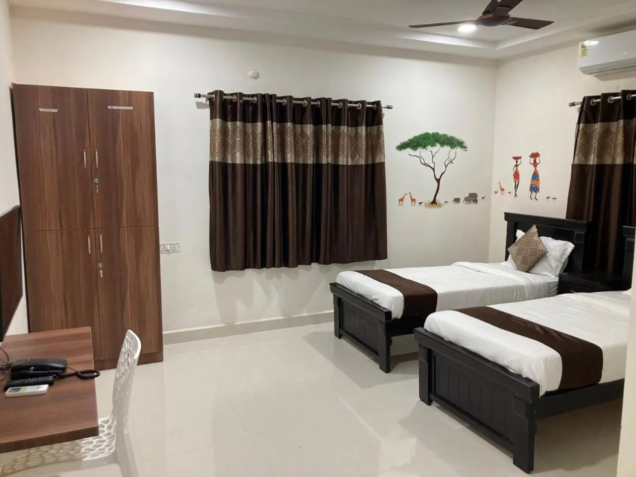 Bed in NirmalVilla Corporate Hotel