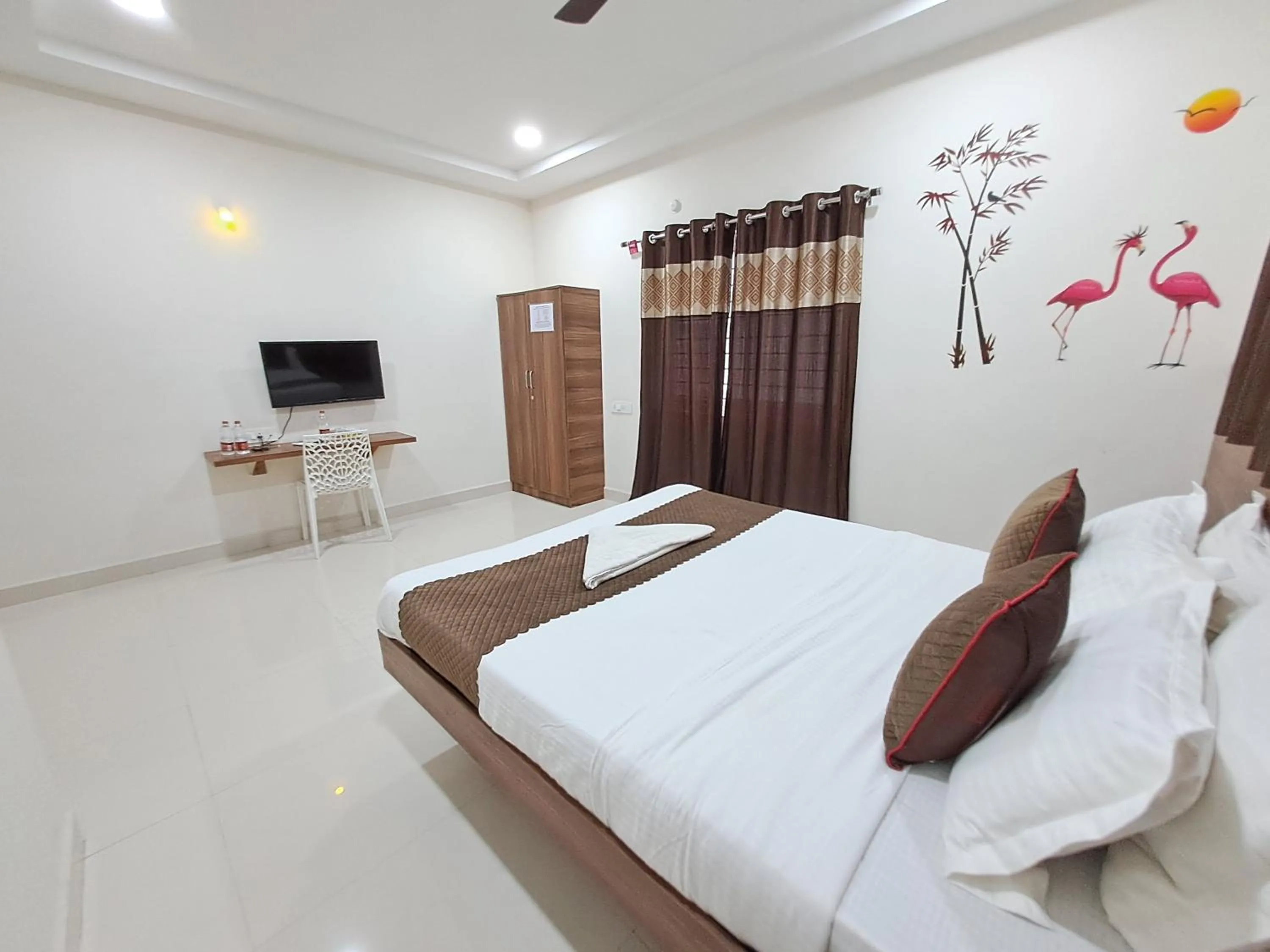 Bed in NirmalVilla Corporate Hotel