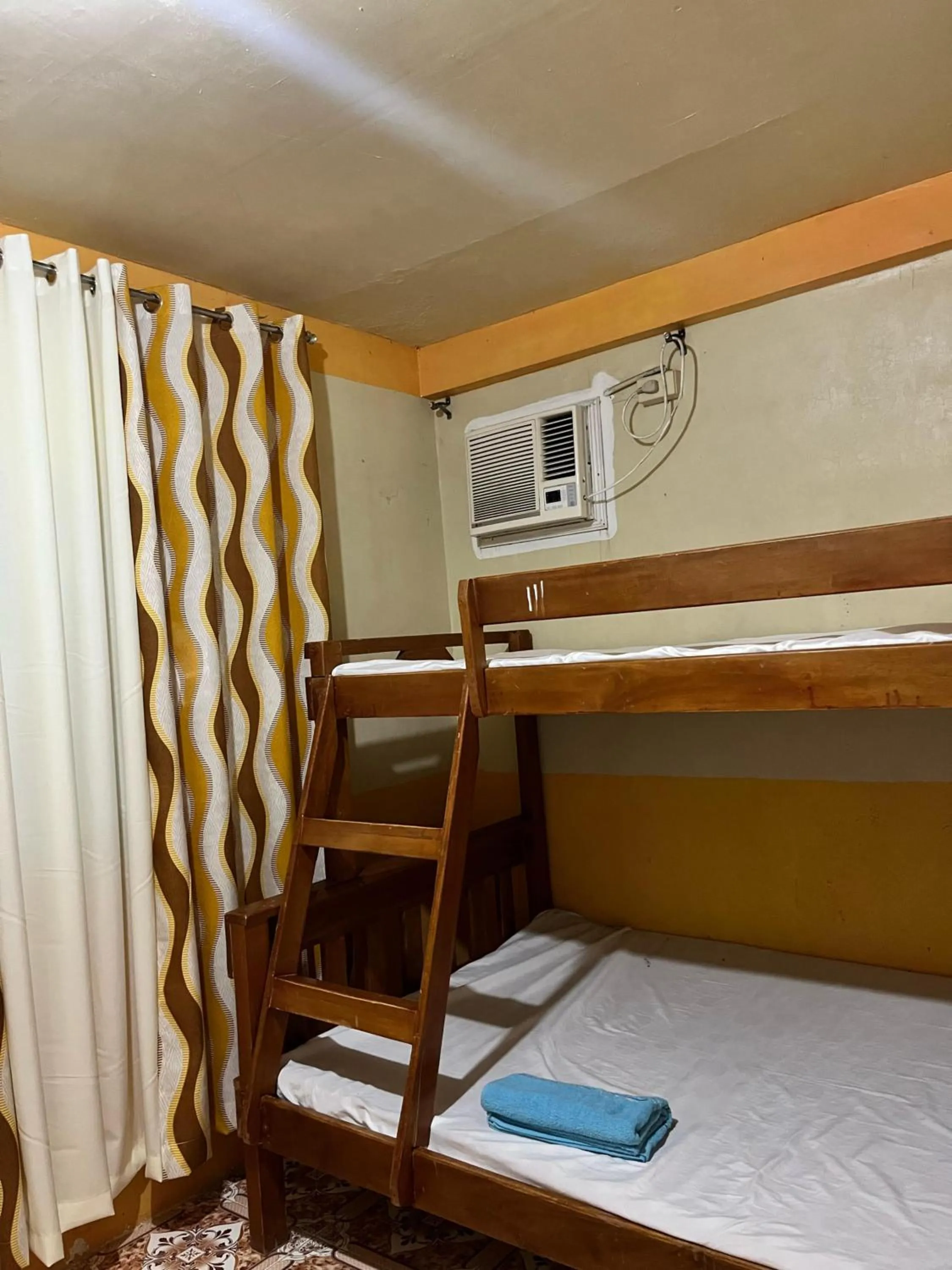 Bed in Isla Paraiso Resort-Hotel