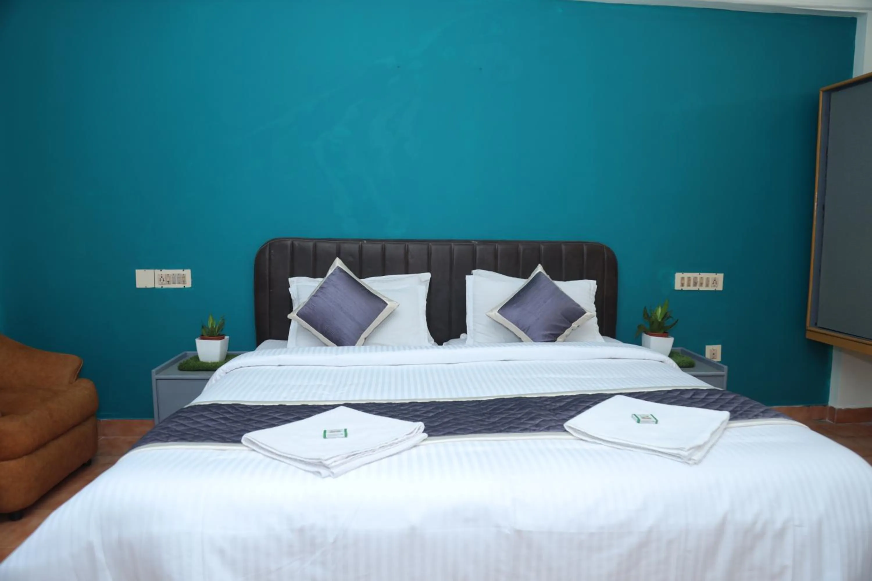 Bed in Grand Harmony Beach Resort