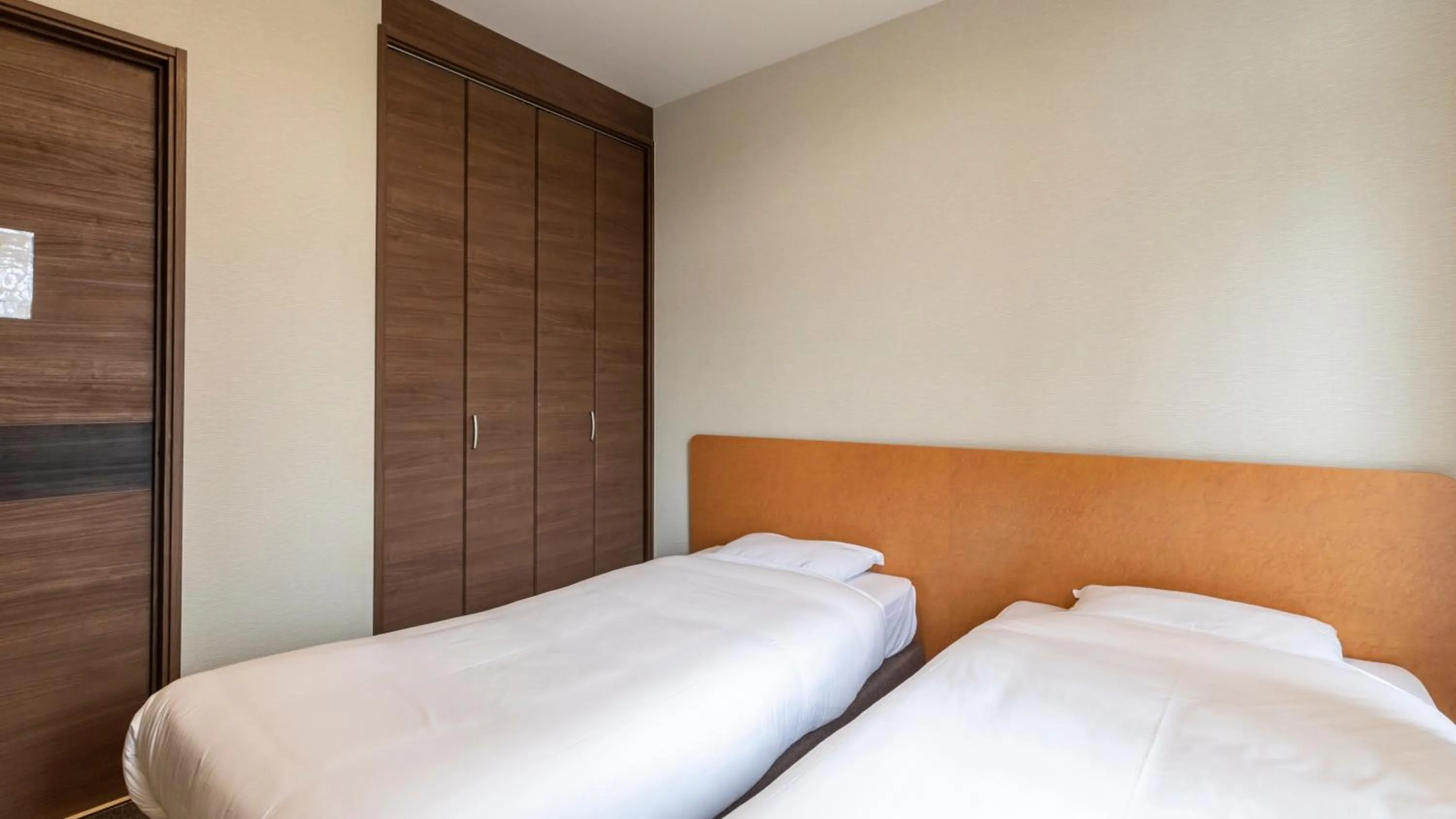 Bed in Tabist International Hotel Kaike